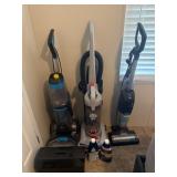 Two Vacuums, One Shampooer, and Cleaning Supplies