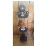 Metal Shelf With Globe and Candle