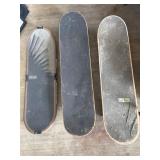 Three Skateboards with Varying Designs