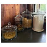 Four Glass Canisters with Lids