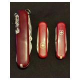 Three Victorinox Swiss Army Knives