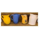 Four Ceramic Pitchers