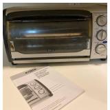 Black and Silver Oster Toaster Oven with Manual