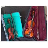 Two Violins with Green and Purple Felt Cases