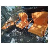 2 Orange Folding Chairs & UT Table