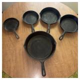 Five Cast Iron Skillets