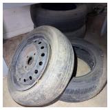 4 Used Car Tires and 1 Steel Wheel