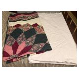 Quilt and White Bedspread
