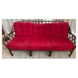 Rattan Sofa with Red Cushions