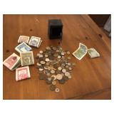 Mini metal bank with large lot of foreign money
