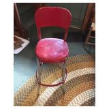 Vintage red metal shop stool