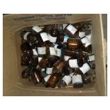 Box full of mini amber chemical bottles