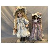 Pair of victorian-style porcelain dolls