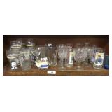 Shelf full of collectors glasses and more
