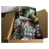 Box of Easter décor and yarn