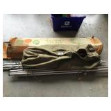 Tent poles, dine net, and wooden cot