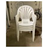Four White Plastic Chairs