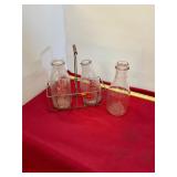 Three Antique Milk Bottles and Carrier