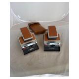 2 Polaroid SX-70 Land Cameras