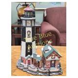 Charming Black and White Lighthouse with Cozy Hous