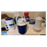 Assorted Beverage Containers and Tins