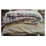 Plush Cushions and Plaid Blankets