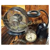 Vintage Desk Fan and Clock Set on Wooden Surface