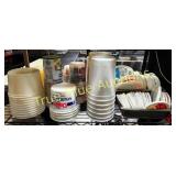 Assorted Plastic Containers and Cups on Metal Rack