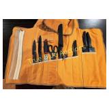 Orange Tool Roll with Various Knives and Scissors