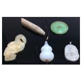 5 HAND CARVED STONE PENDANTS