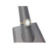 GOLD RING W OPAL CENTER & PURPLE AMYTHYST