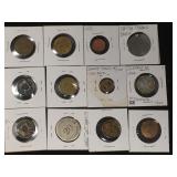 12 Various tokens, one German 50 Deutrich.