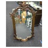 Ornately framed mirror,  approximately 24x40.