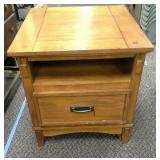 Wooden end table with drawer, shelf and electric.