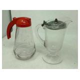 2 Vintage syrup pitchers. Chip on base.