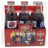 6 Pack of 8oz full Coca-Cola Bottles, 1 is a Diet