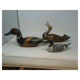 3 wooden ducks, 1 has brass head.