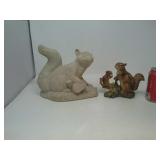 2 squirrel figures.