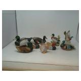 9 figurines,  1 is a pipe holder.