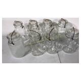 Eight clear mason jar's with bails and glass lids