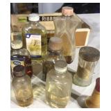 Eight old medicine bottles in a cigarbox