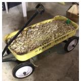 Yellow radio flyer wagon full of landscape rocks