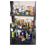 Three shelves full of cleaning supplies