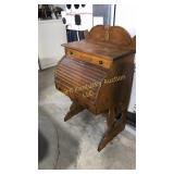 Child's size rolltop desk in Oak, has two drawers