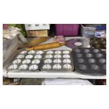 Two rolling pins, muffin tins, tray, cookie