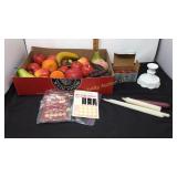 Plastic fruit, candles, wax candle adapters