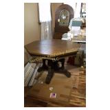 Footed octagon wood table, 44 inches in diameter