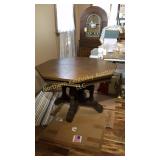 Footed octagon wood table, 44 inches in diameter