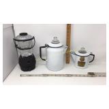 Two enamel coffee pots and one wind up light.