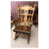 Large solid wood rocker stands 46 inches tall.